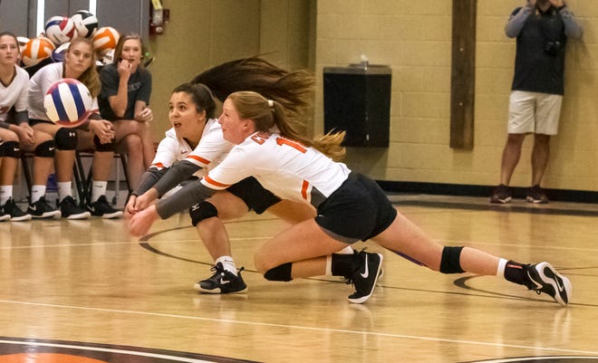 MTCS' Mackenzie Harris (right) and Maggie Tidwell try to make a save from a St. George's kill during Saturday's DII-A state quarterfinals.