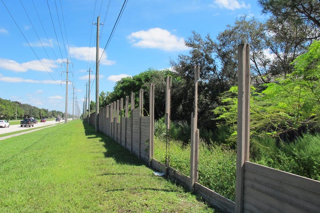 A concrete wall along the south side of Vanderbilt Beach Road in North Naples has been an eyesore since Hurricane Irma knocked out sections of it last fall. 