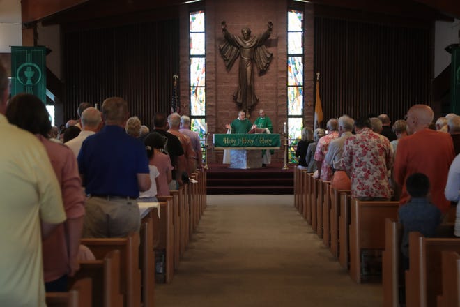 Parishioners attend Sunday Mass at Sacred Heart Catholic Church in Palm Desert, Calif., October 14, 2018. Monsignor Howard Lincoln addressed the sexual assault allegations against Peter McCormick, who was a priest at Sacred Heart from 1984 to 2000, during Mass.