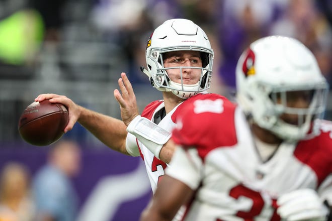 Cardinals rookie quarterback Josh Rosen looks to throw a pass during a game against the Vikings at U.S. Bank Stadium.