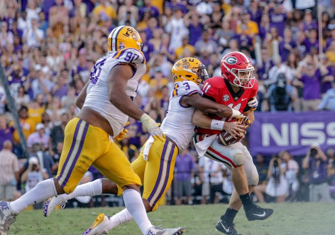 LSU safety JaCoby Stevens sacks Georgia quarterback Jake Fromm during the second half at Tiger Stadium.
