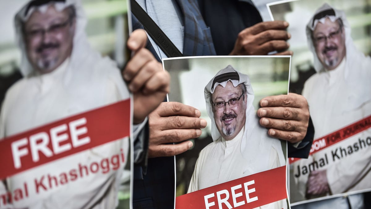 Protestors hold pictures of missing journalist Jamal Khashoggi during a demonstration in front of the Saudi Arabian consulate, Oct, 8, 2018 in Istanbul.