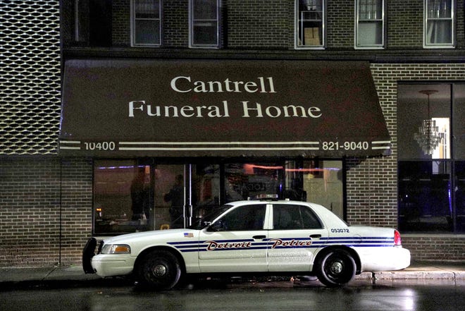 A Detroit Police vehicle parked outside of the Cantrell Funeral Home in Detroit on Friday, October 12, 2018. The decomposed bodies of 11 infants were found in the ceiling of the former funeral home on Oct. 12, 2018.
