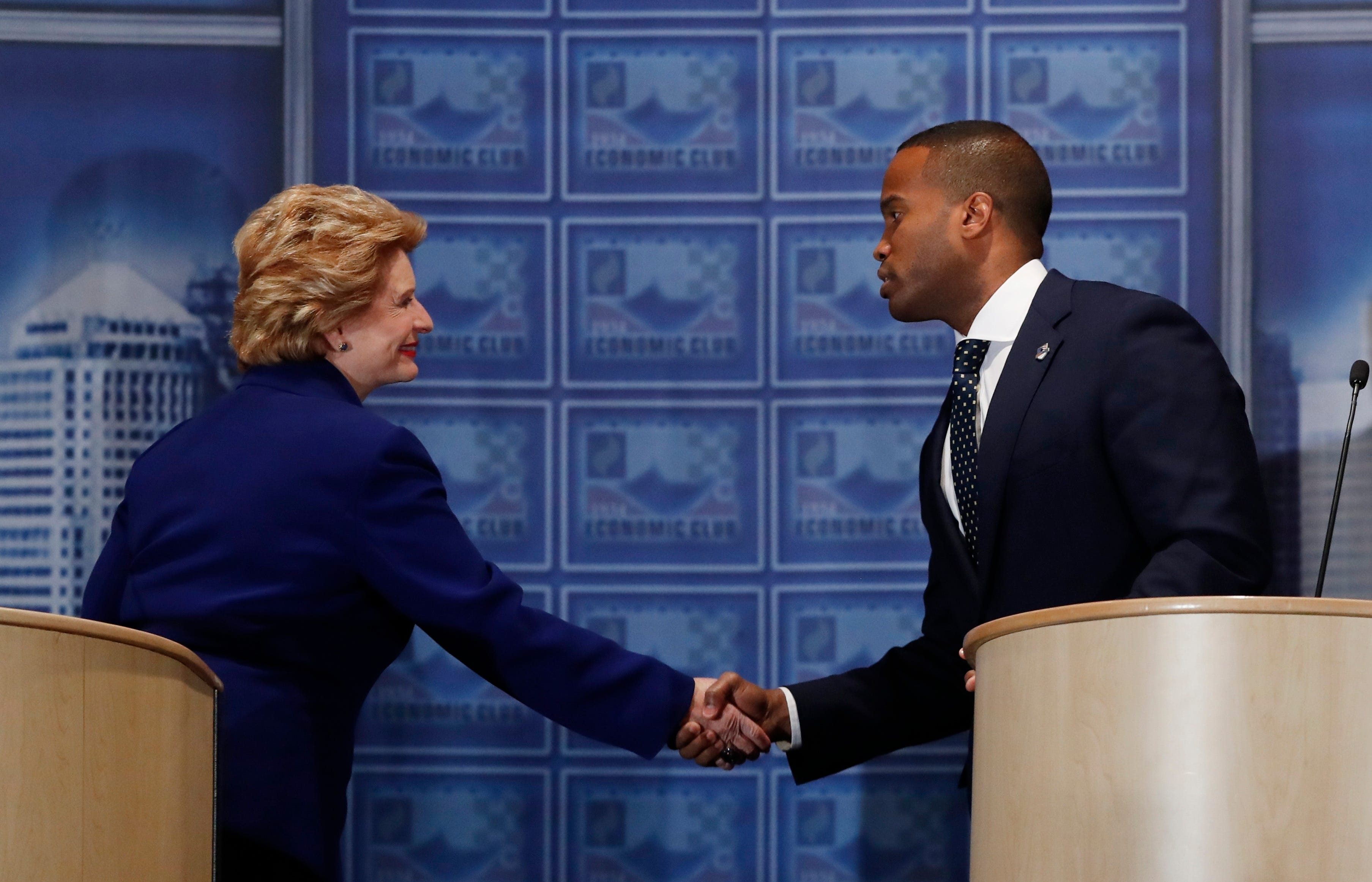 Sen. Debbie Stabenow, D-Mich., left,and challenger John James shake hands after their debate at the Detroit Economic Club, Monday, Oct. 15, 2018, in Detroit. Stabenow is seeking a fourth term and has led comfortably in polls, and James, a business executive and combat veteran, participated in their second debate before the November election.