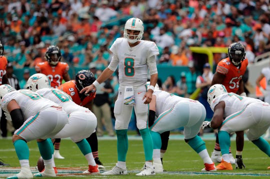 Dolphins quarterback Brock Osweiler calls a play during the first half against the Chicago Bears Sunday in Miami.