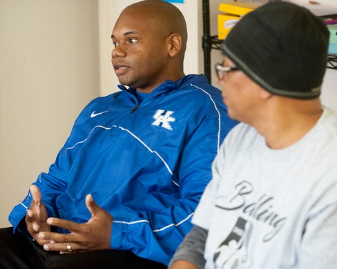 Kentucky Commissioner of Education Wayne Lewis chats with Balling for a Cause members at the Chestnut Street YMCA as the basketball group's spokesman, Christopher 2X looks on..October 13, 2018