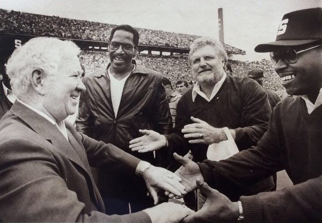 Duffy Daugherty, left, and three members of the 1965 powerhouse Spartan team meet during halftime of the MSU vs.  Illinois game.  Left to right, even, defensive ends Bubba Smith and Bob Viney, and linebacker Charlie 