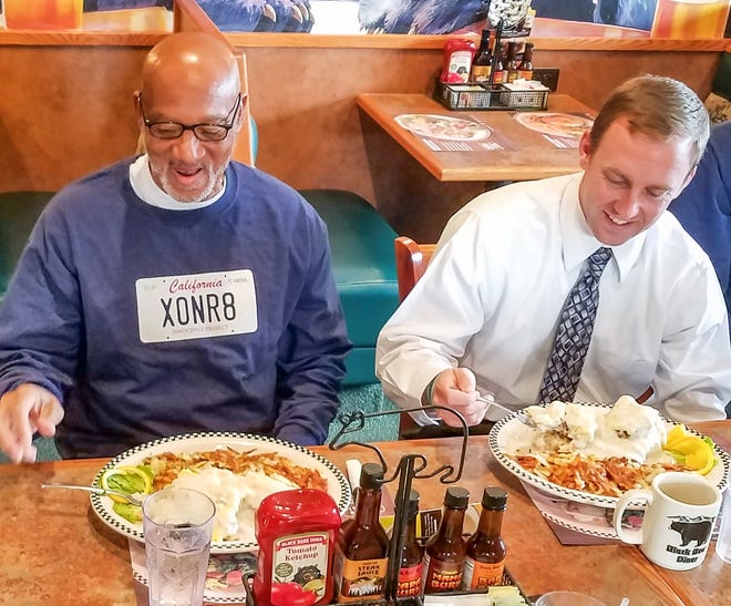 Horace Roberts enjoys his first meal as a free man next to his attorney, Michael Semanchik of the California Innocence Project.