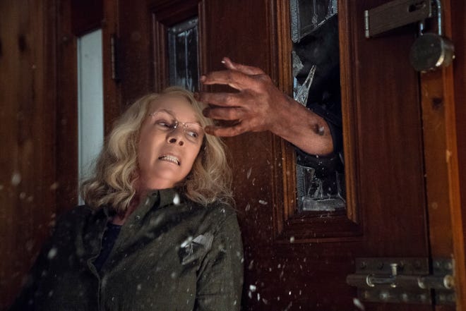 Laurie Strode (Jamie Lee Curtis) barricades herself inside her home (to no avail) in "Halloween."