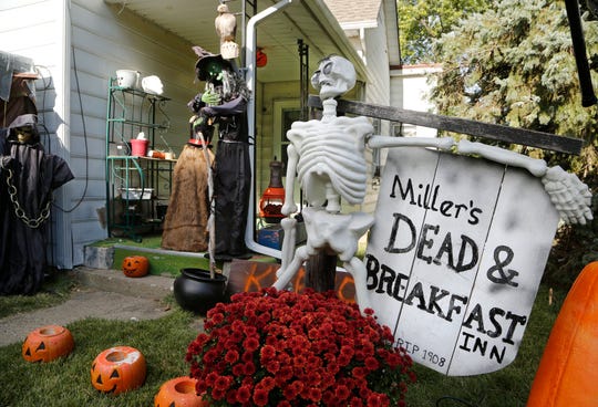 Halloween decorations cover the front yard of Ken and Connie Miller's home Tuesday, October 16, 2018, in the 2600 block of Main Street in Lafayette. The couple creates and personalizes most of the decorations by hand. The Dead & Breakfast Inn even has the real year the house was built.