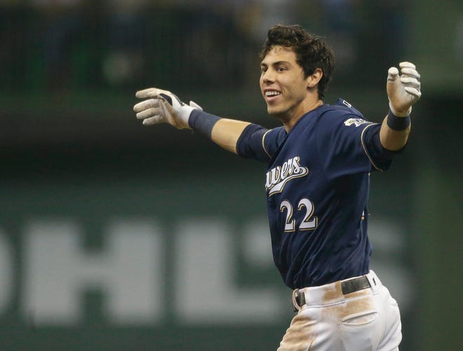 Milwaukee Brewers' Christian Yelich reacts after driving in the game winning run during the ninth inning of a baseball game against the Chicago Cubs Monday, Sept. 3, 2018, in Milwaukee. The Brewers won 4-3. (AP Photo/Aaron Gash) ORG XMIT: WIAG116
