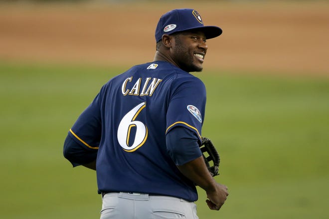 Brewers centerfielder Lorenzo Cain Is all smiles as heads back to the dugout after the Dodgers' final out of the bottom of the fourth inning of Game 3 on Monday night.