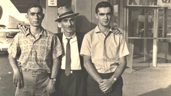 The Osso boys, Fred, left, and Charlie, right, pose with their father in 1966.