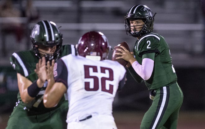 El Diamante High quarterback Parker Boswell (2) looks to pass against Mt. Whitney in a West Yosemite League high school football game on Friday, October 12, 2018.