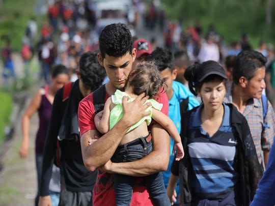 A caravan of more than 1,500 Honduran migrants moves north after crossing the border from Honduras into Guatemala on Oct. 15, 2018 in Esquipulas, Guatemala.