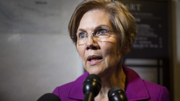Sen. Elizabeth Warren, D-Mass., speaks to members...