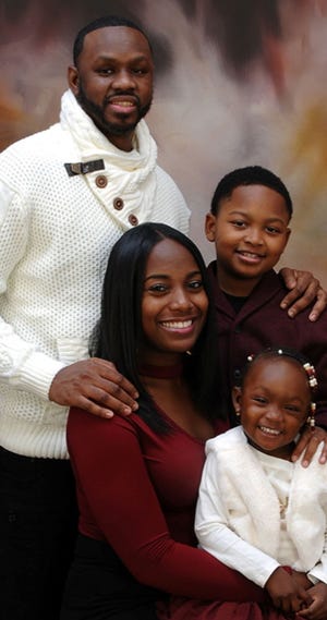 Issa Sao, with his wife, Eboni, and their two children, now ages 11 and 3. He is in federal custody and facing imminent deportation to Mauritania.