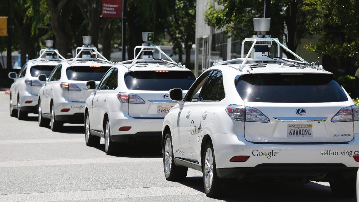 A row of Google self-driving cars outside the Computer History Museum in Mountain View, Calif., 2014