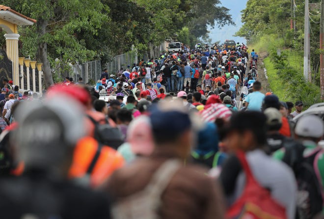 ESQUIPULAS, GUATEMALA - OCTOBER 15:  A caravan of more than 1,500 Honduran migrants moves north after crossing the border from Honduras into Guatemala on October 15, 2018 in Esquipulas, Guatemala. The caravan, the second of 2018, began Friday in San Pedro Sula, Honduras with plans to march north through Guatemala and Mexico en route to the United States. Honduras has some of the highest crime and poverty rates in Latin America.  (Photo by John Moore/Getty Images) ORG XMIT: 775243532 ORIG FILE ID: 1052219378