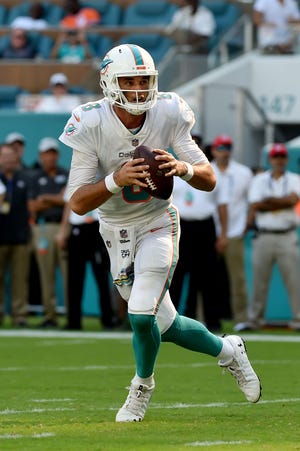 Miami Dolphins quarterback Brock Osweiler (8) throws a pass Chicago Bears during the second half at Hard Rock Stadium.