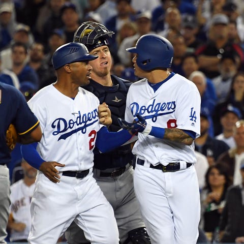 Dodgers shortstop Manny Machado and Jesus Aguilar...