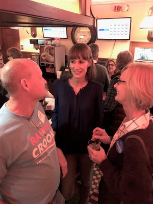 Rachel Crooks, center, speaks to supporters during a campaign stop at Chud's Grille in Fremont on Wednesday night.