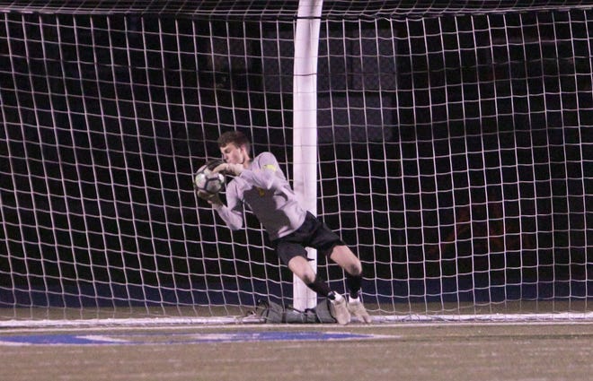 Hartland goalkeeper Kieran Malachino stop a shot by Lakeland in the first half of the district semifinal soccer game on Wednesday, Oct. 17, 2018.