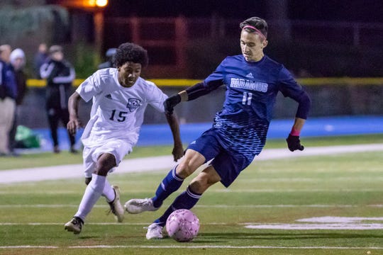 Paramus #11 Nick Sallemi advancing the ball against Hackensack on Wednesday, October 17, 2018.