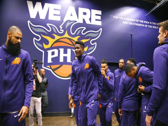 Rookie Deandre Ayton, center, gets ready for his NBA regular-season debut Wednesday when the Suns hosted the Mavericks. Reports on 1C and at suns.azcentral.com. 
 Rob Schumacher/The Republic
Phoenix Suns rookie Deandre Ayton makes debut against the Dallas Mavericks during the season opener at Talking Stick Resort Arena on Oct. 17, 2018, in Phoenix, Ariz.