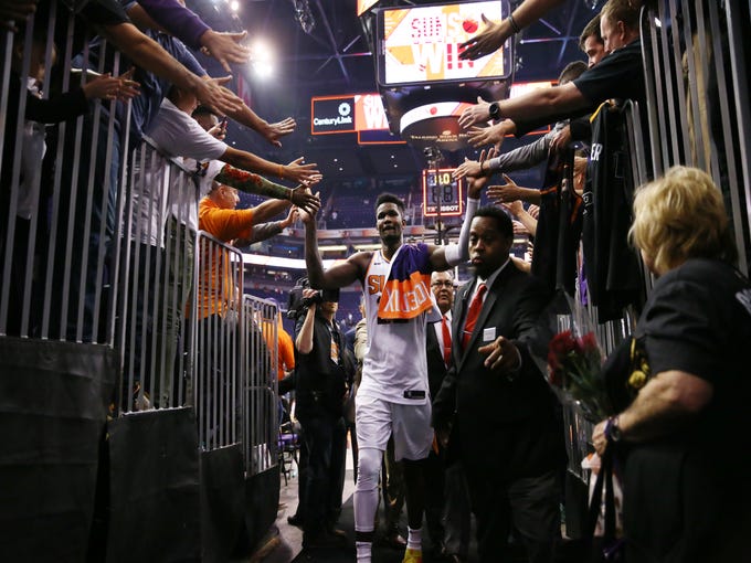 Phoenix Suns rookie center Deandre Ayton is greeted by the fans after beating the Dallas Mavericks during the season opener at Talking Stick Resort Arena on Oct. 17, 2018, in Phoenix, Ariz.