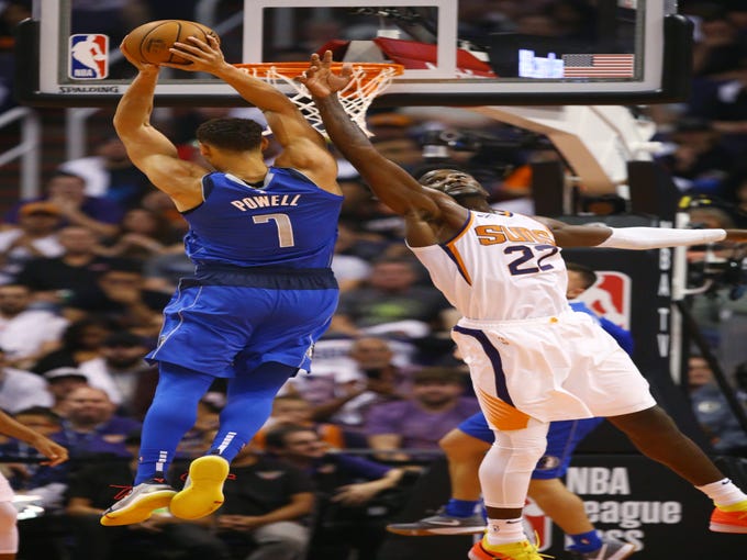 Phoenix Suns 	Deandre Ayton guards Dallas Mavericks Dwight Powell during the season opener at Talking Stick Resort Arena on Oct. 17, 2018, in Phoenix, Ariz.