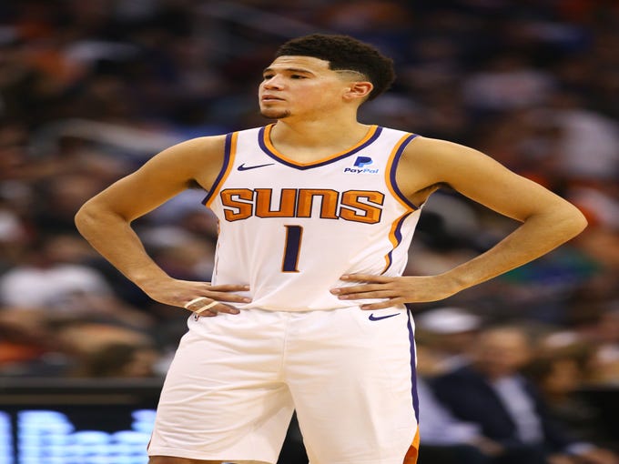 Phoenix Suns Devin Booker against the Dallas Mavericks during the season opener at Talking Stick Resort Arena on Oct. 17, 2018, in Phoenix, Ariz.