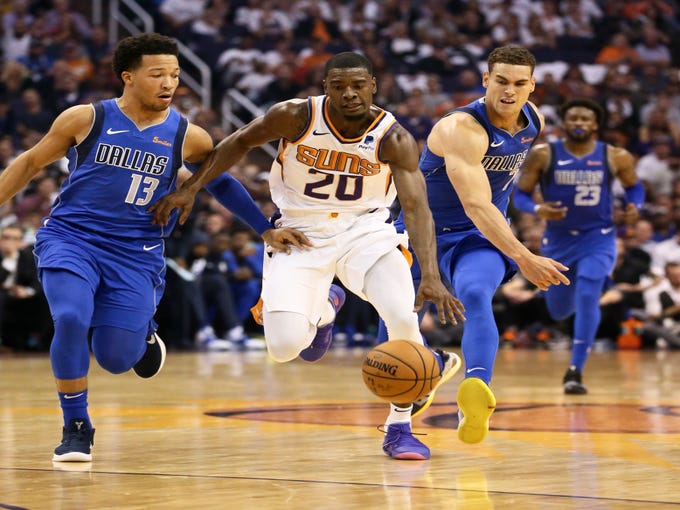 Phoenix Suns 	Josh Jackson is pressured by Dallas Mavericks Jalen Brunson (13) during the season opener at Talking Stick Resort Arena on Oct. 17, 2018, in Phoenix, Ariz.