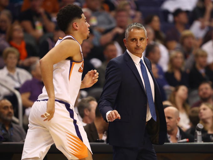 Oct 17, 2018; Phoenix, AZ, USA; Phoenix Suns guard Devin Booker (left) and head coach Igor Kokoskov against the Dallas Mavericks at Talking Stick Resort Arena. Mandatory Credit: Mark J. Rebilas-USA TODAY Sports