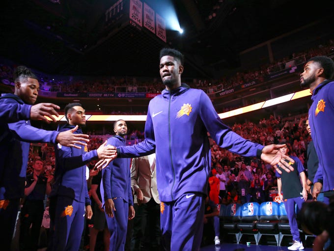 Suns center Deandre Ayton is introduced before Wednesday?s season opener vs. the Dallas Mavericks.
 Rob Schumacher/The Republic
Phoenix Suns center Deandre Ayton during introductions against the Dallas Mavericks during the season opener at Talking Stick Resort Arena on Oct. 17, 2018, in Phoenix, Ariz.