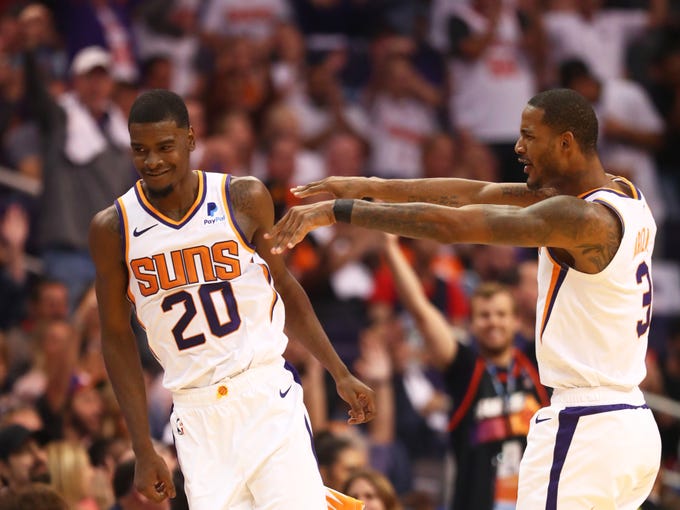 Oct 17, 2018; Phoenix, AZ, USA; Phoenix Suns forward Josh Jackson (20) celebrates with Trevor Ariza in the fourth quarter against the Dallas Mavericks at Talking Stick Resort Arena. Mandatory Credit: Mark J. Rebilas-USA TODAY Sports