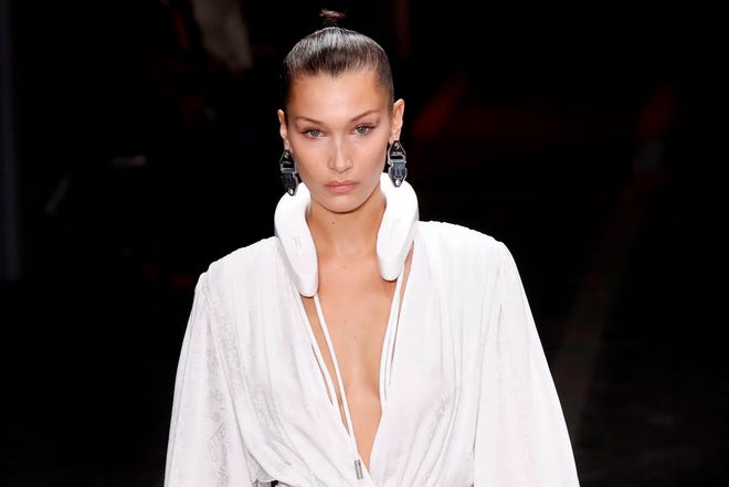 Bella Hadid presents a creation by Off-White during the Spring-Summer 2019 Ready-to-Wear collection fashion show in Paris, on Sept. 27, 2018.