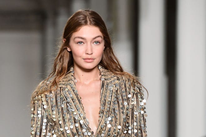 Gigi Hadid presents a creation during the presentation of the Roberto Cavalli fashion show, as part of the Women's Spring/Summer 2019 fashion week in Milan, on Sept. 22, 2018.