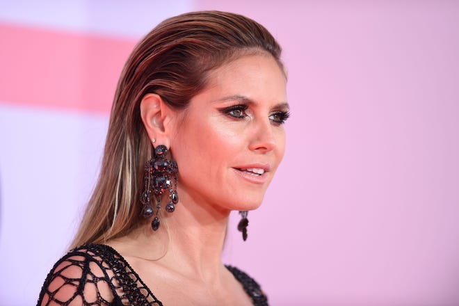 German model Heidi Klum arrives at the 2018 American Music Awards on Oct. 9, 2018, in Los Angeles.
