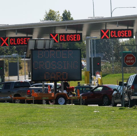 Cars waiting to enter the United States from...