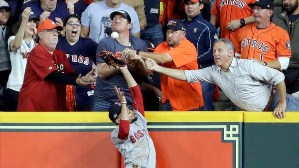 Fans interfere with Boston Red Sox right fielder...