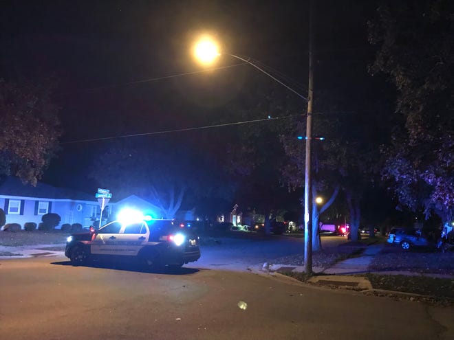 Police were outside a home in the 800 block of West Frances Street in Appleton Thursday evening attempting to get two people with arrest warrants to leave a residence.