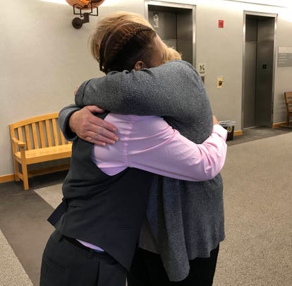 C'Nai Lange, 17, and her mom, Kathy Lange, both of Macomb Township, hug after the Lange family adopted C'Nai on Oct. 19, 2018 in Macomb County Circuit Court.