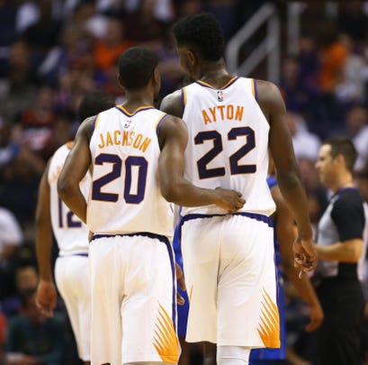 Josh Jackson and Deandre Ayton talk as they come off the court during a game against the Mavericks at Talking Stick Resort Arena.