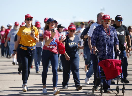 Trump supporters enter the International Air Response Hangar in Mesa for tonight's Make America Great Again Rally.