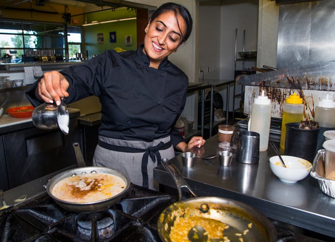 Sasha Raj, the self-proclaimed “vegan superhero”, cooks up some pumpkin rice pudding at her restaurant, 24 Carrots in Tempe, Wednesday, October 17, 2018.
