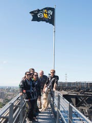 Prince Harry, Australian Prime Minister Scott Morrison, second from right, and representatives of the Invictus Games on the Sydney Harbor Bridge to send the Invictus Games flag on October 19, 2018.