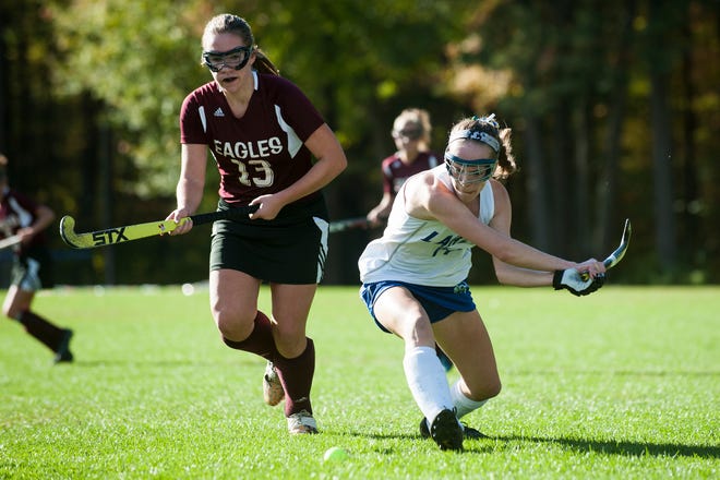 Colchester's Patra Bajuk (14) hits the ball down the field past Mt. Abraham's Abby Hoff (13) during the field hockey game between Mount Abraham and Colchester at Colchester High School on Saturday morning October 20, 2018 in Colchester.