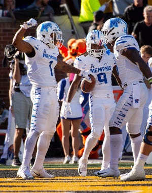 Memphis wide receiver Tony Pollard, left, celebrates his touchdown with teammates during the first half of an NCAA college football game against Missouri, Saturday, Oct. 20, 2018, in Columbia, Mo.