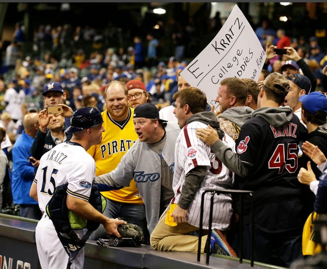 Milwaukee Brewers catcher Erik Kratz is greeted by his college friends before Game 6 of the National League Championship Series Oct. 19 at Miller Park.